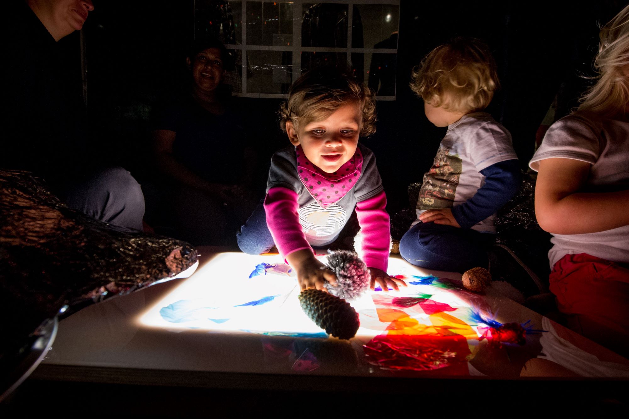 Toddler with a light